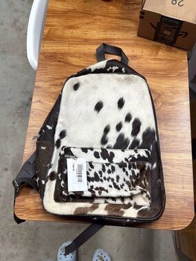 Cowhide Pattern Sling Backpack in Black & White